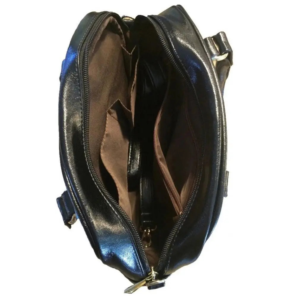 Interior view of black PU leather trunk handbag with multiple storage compartments and brown fabric lining.