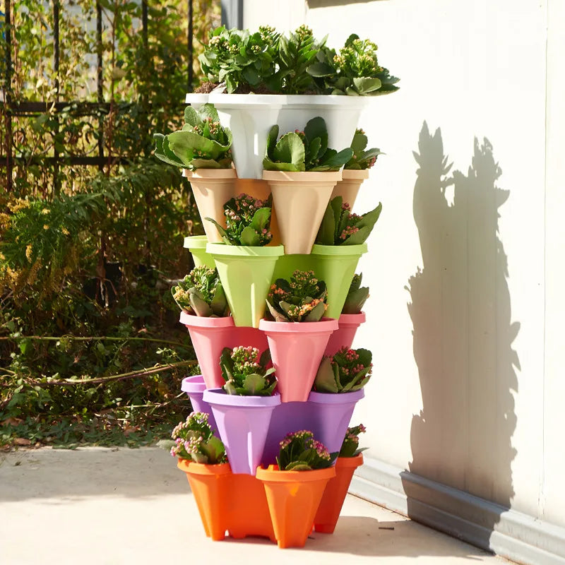 Stackable vertical flower pot planter tower, multi-color plastic tiers with small flowering plants