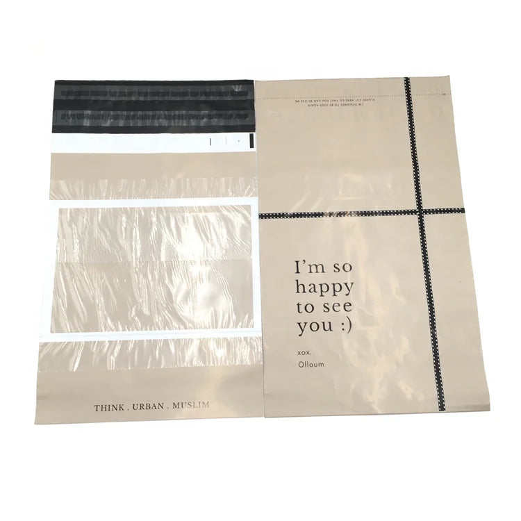 Cream poly mailer bags with black strip seal, printed note "I'm so happy to see you"