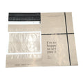 Cream poly mailer bags with black strip seal, printed note "I'm so happy to see you"