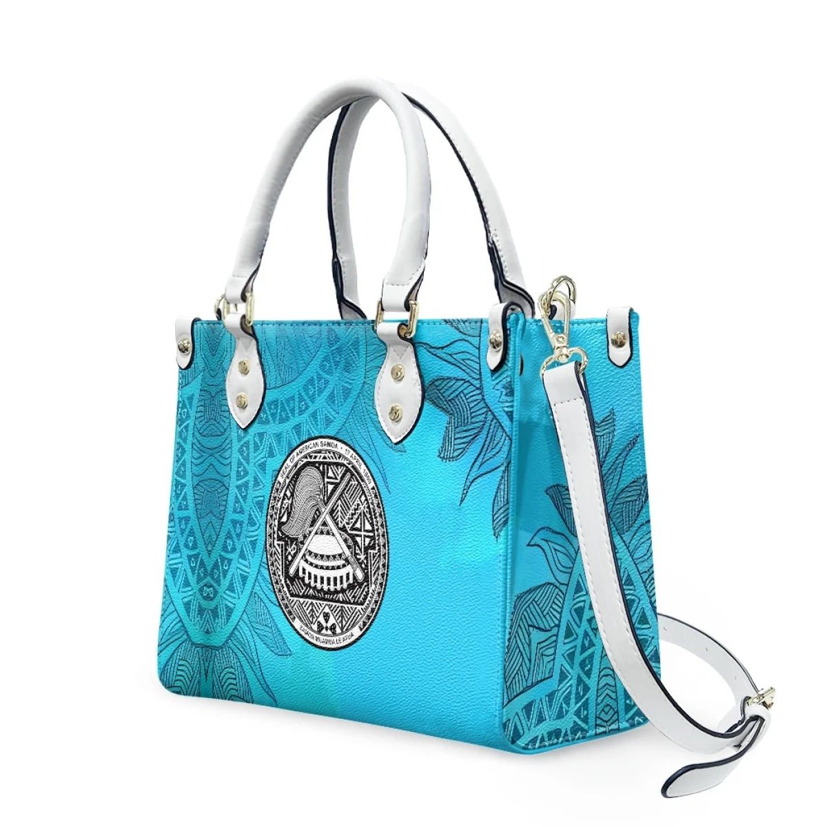 Blue luxury leather handbag featuring Samoan tribal patterns, floral designs, and American Samoa seal, with white straps.