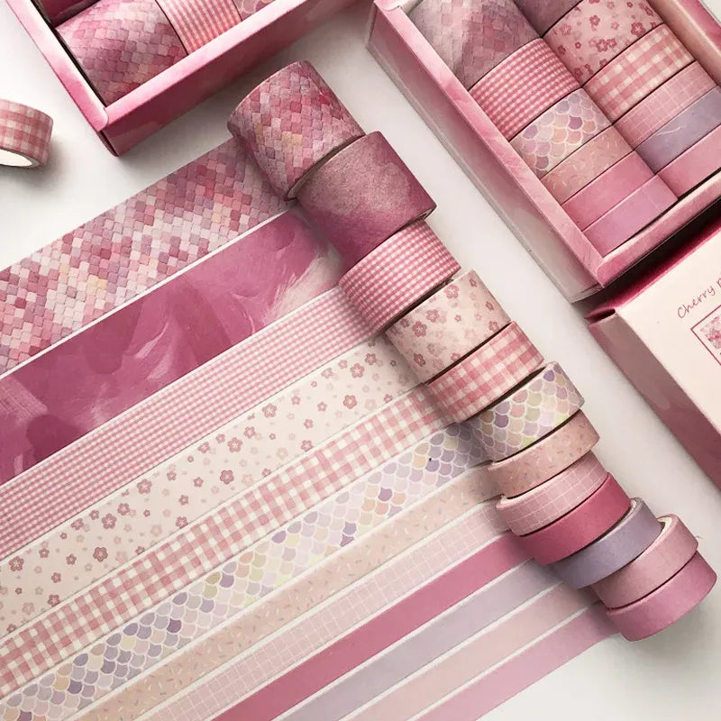 Washi tape set with pink floral, gingham, and mosaic patterns on narrow strips