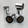 Black thermal transfer ribbon rolls on metallic backing, multiple spools