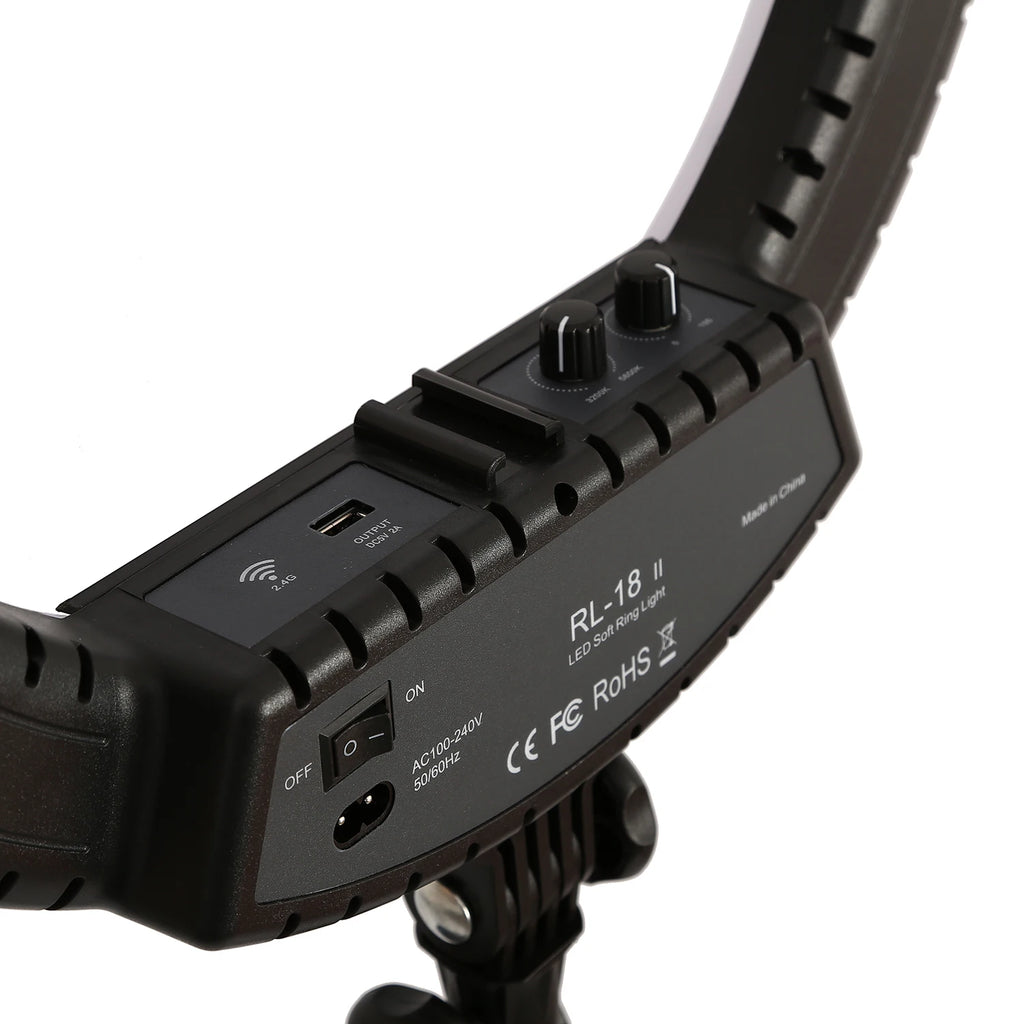 Black RL-18 II LED ring light control panel with two adjustment knobs, power switch, and USB output port.