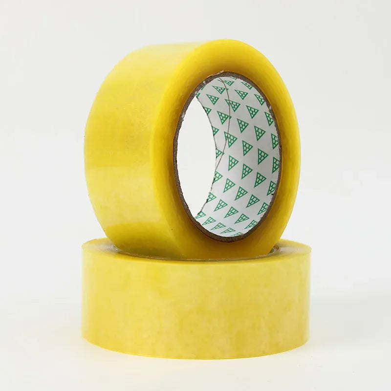 Yellow packing tape roll with green logo-pattern core visible in the center