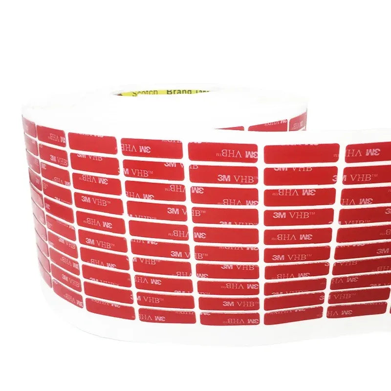 Rolled red double-sided acrylic foam tape with printed backing on the wound roll