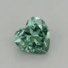 Small heart-cut lab-grown diamond in vivid green on a light background