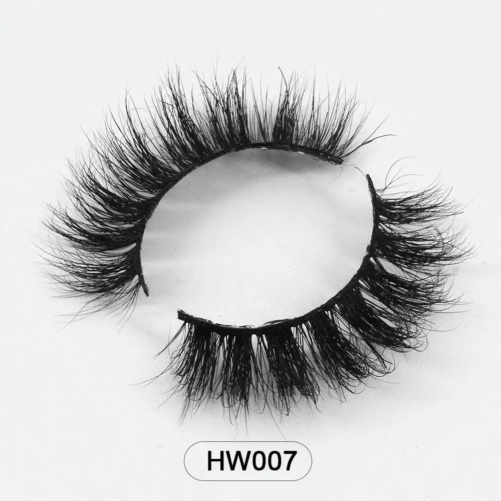 A pair of black 3D mink false eyelashes with a soft, flexible band on a white background, labeled "HW007."