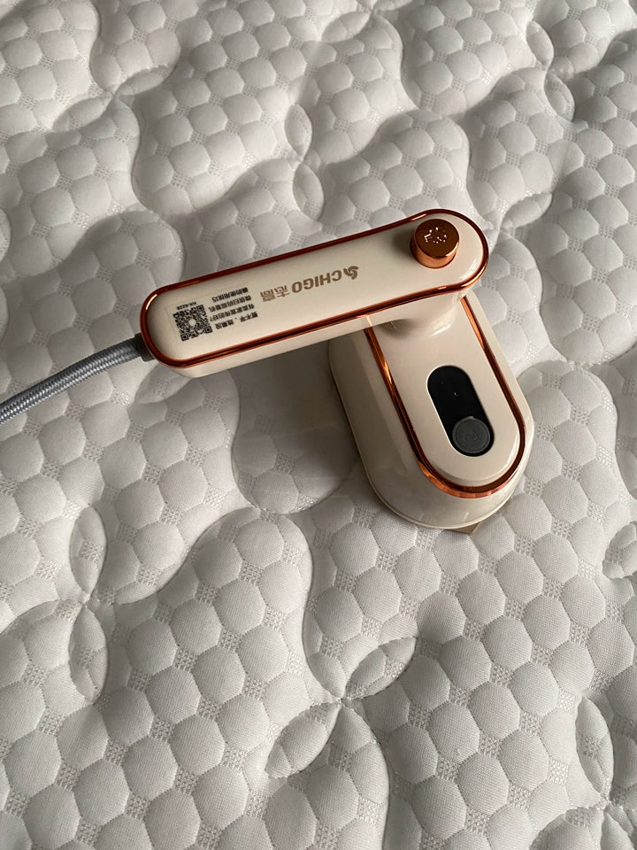 Tidesmit portable handheld steam iron showing compact design for easy wet and dry garment steaming at home