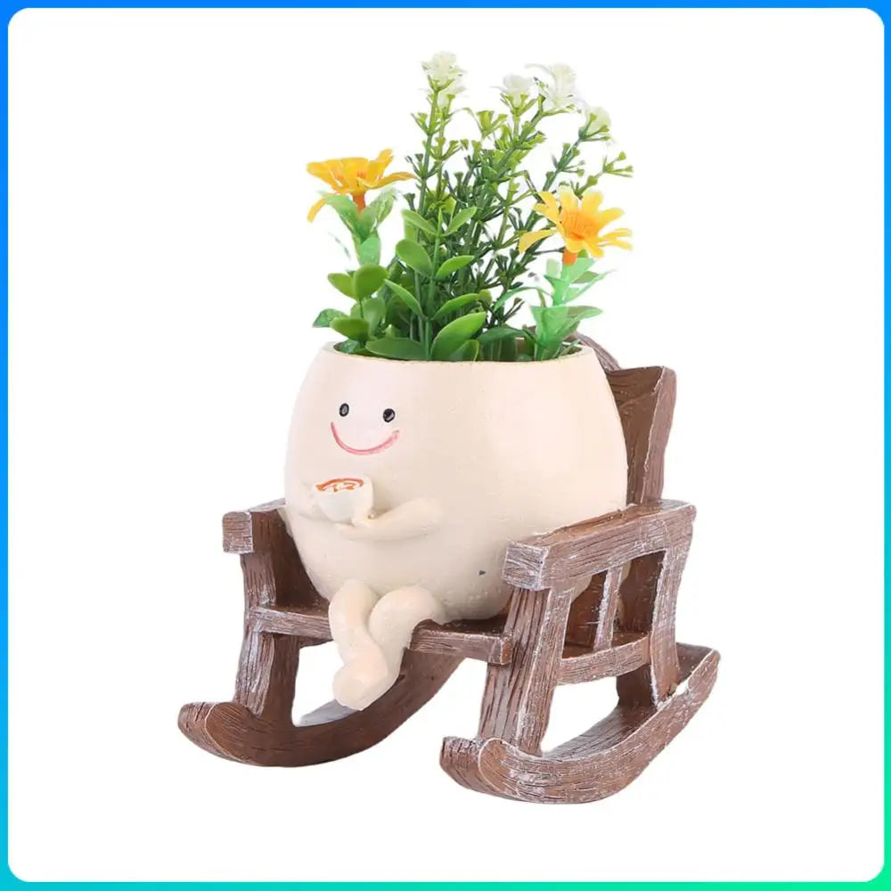 Smiling rocking succulent pot planter with chair base holding colorful flowers