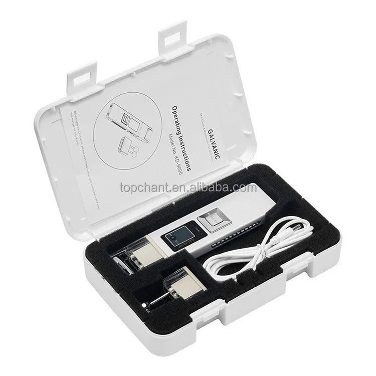 White case containing a silver galvanic facial device, roller attachment, and white charging cable with instructions.