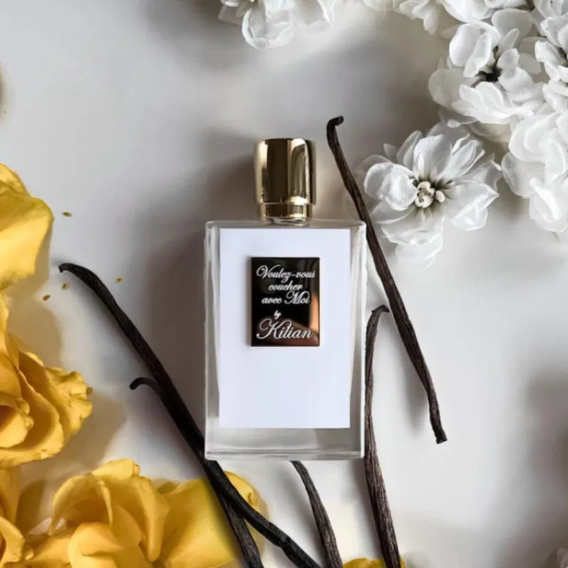 Kilian unisex perfume 50ml bottle with gold cap, white label, vanilla beans, and yellow/white floral background.