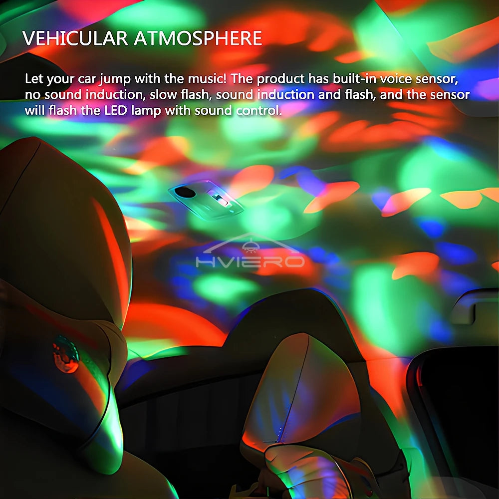 Small LED interior car light projecting colorful, music-reactive red and green light patterns onto the vehicle ceiling.