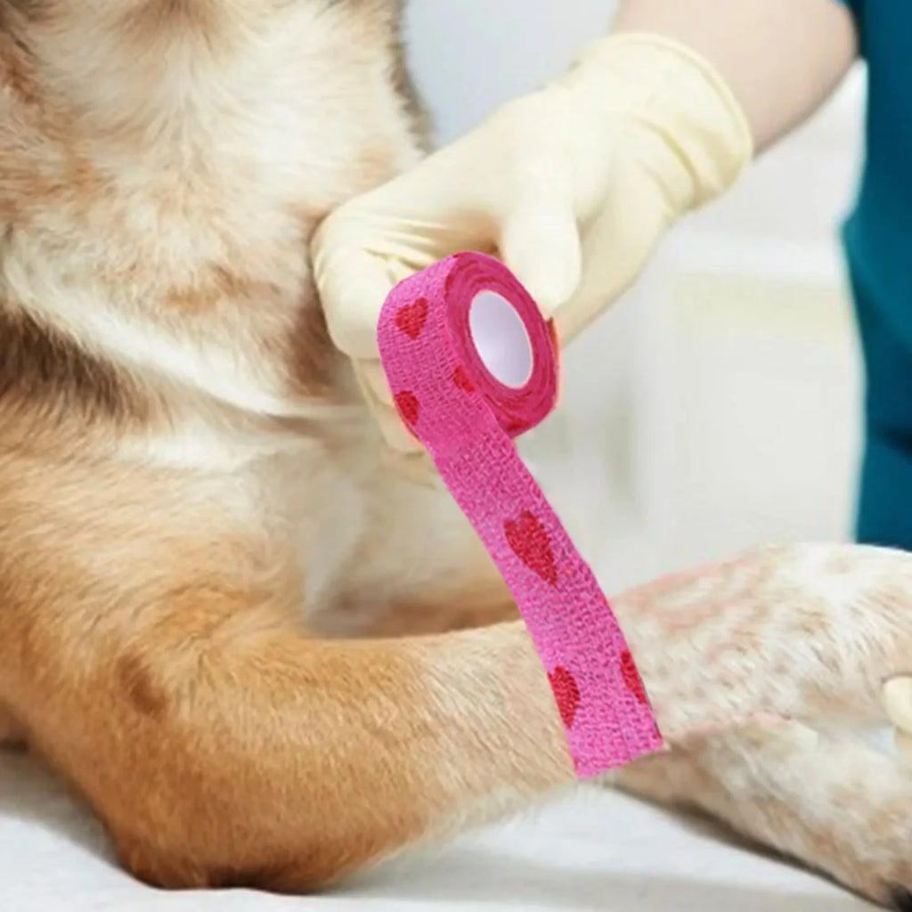 Pink heart-pattern breathable, self-adherent bandage for dog or cat wound care and injury support.