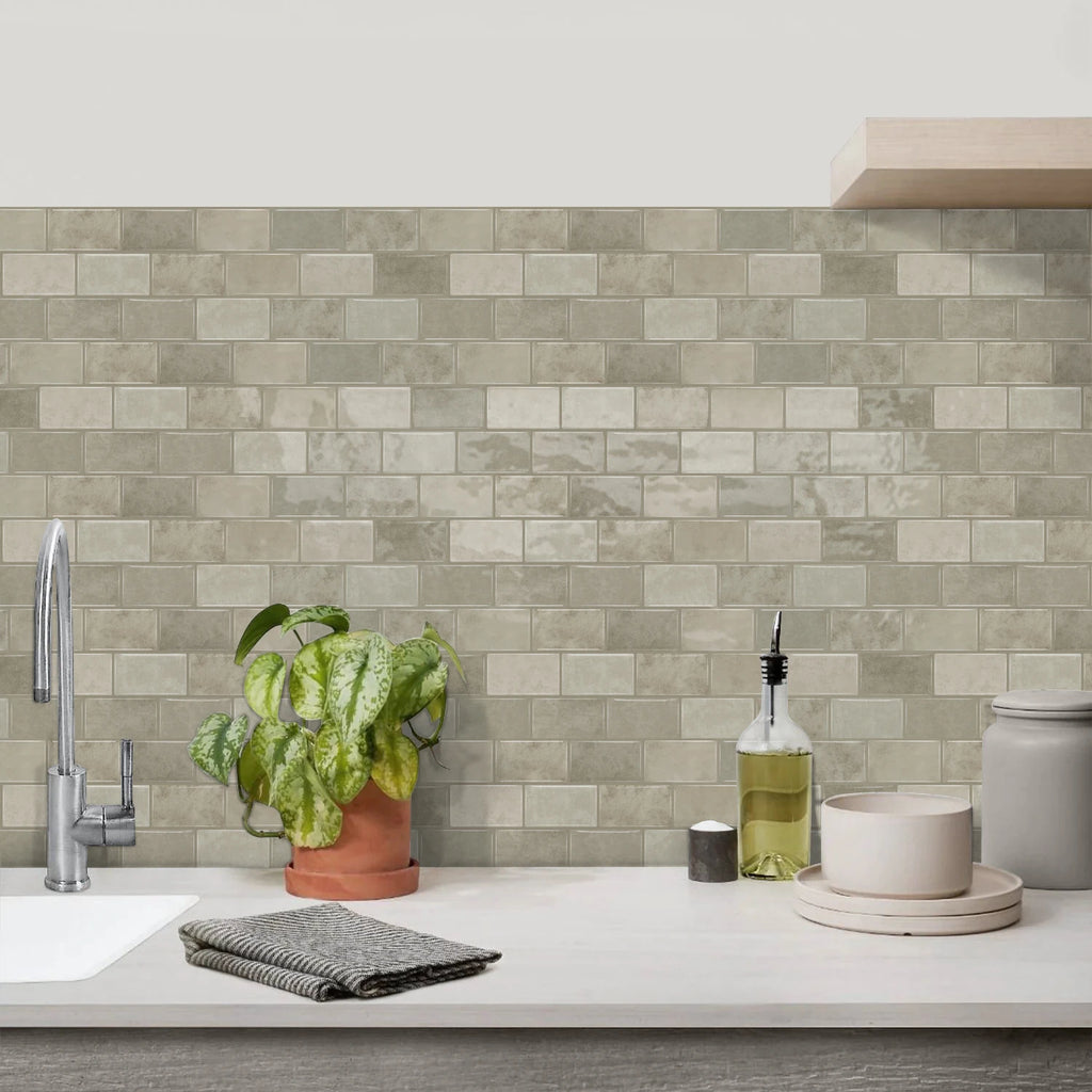 Gray ceramic tile sticker strip backsplash with textured brick-style rectangular tile pattern