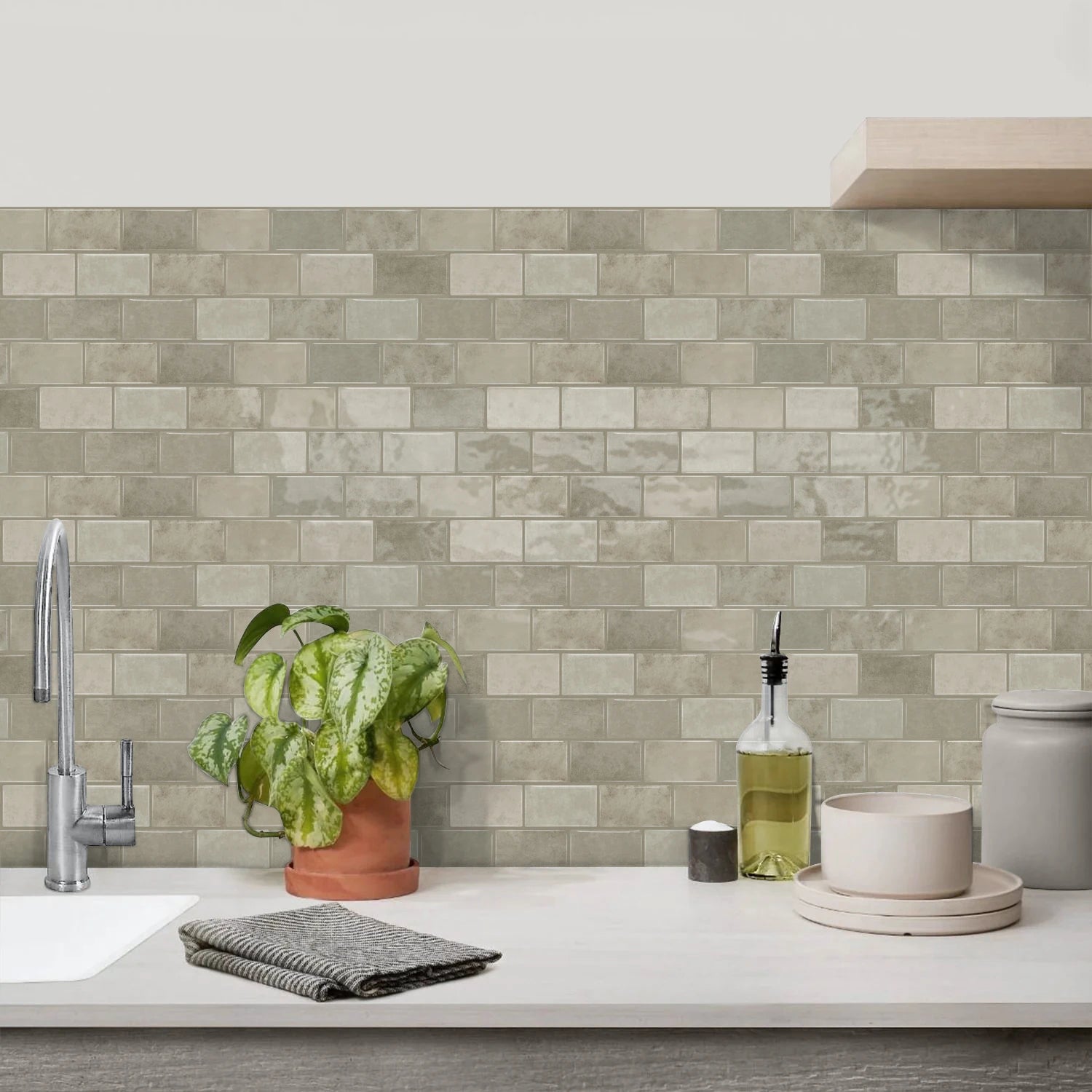 Gray ceramic tile sticker strip backsplash with textured brick-style rectangular tile pattern