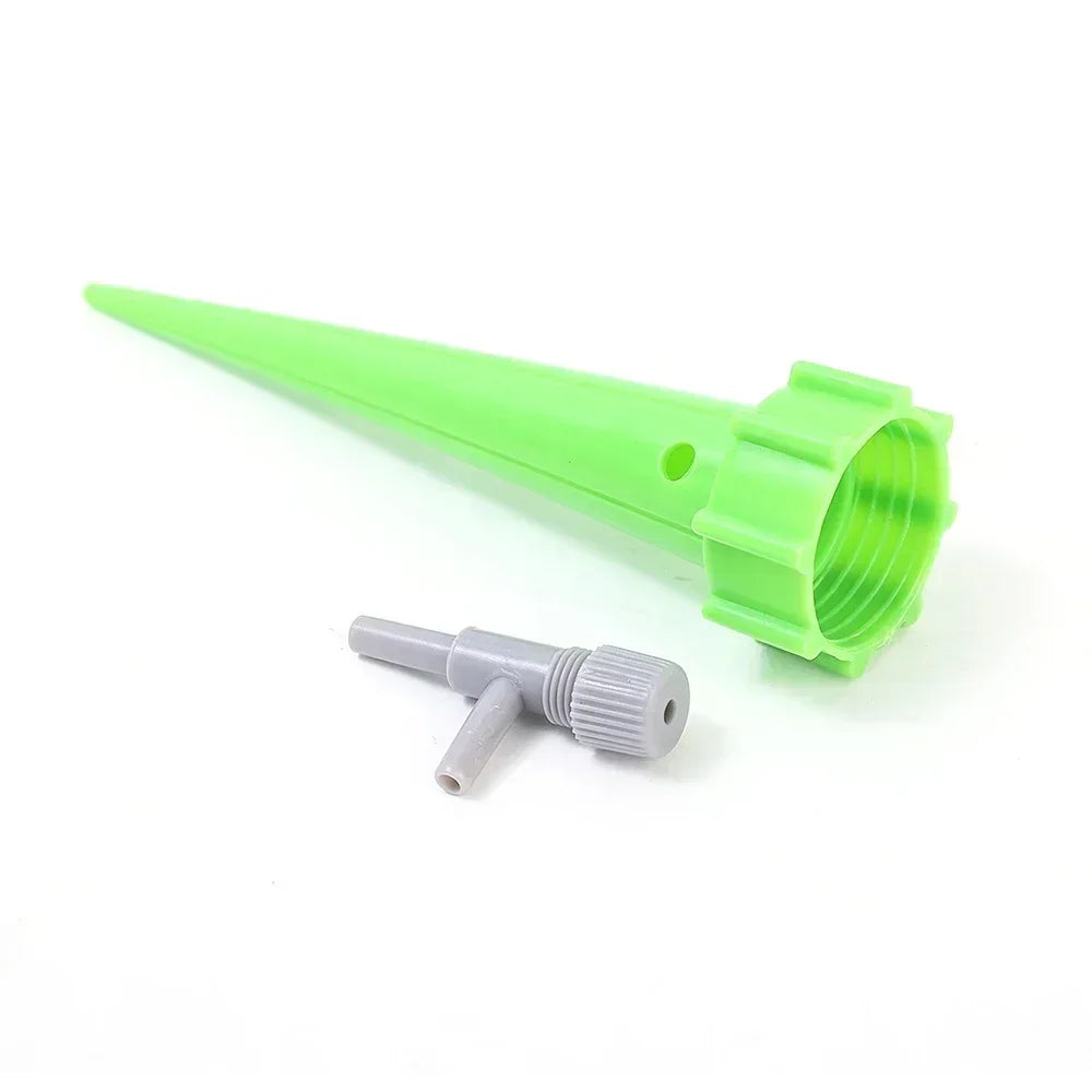Green drip irrigation stake with adjustable valve and spike tip for plant watering