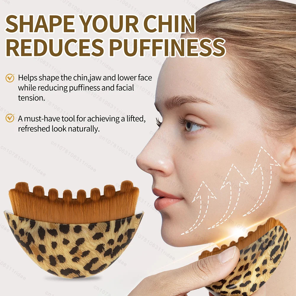 Curved leopard-print facial massage brush with dense, brown bristles for lymphatic drainage and skin contouring.