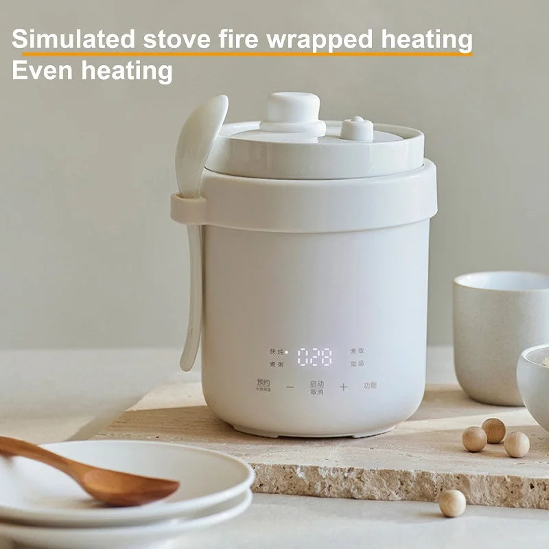 Smart white electric rice cooker pot with lid and side loop handle on countertop.