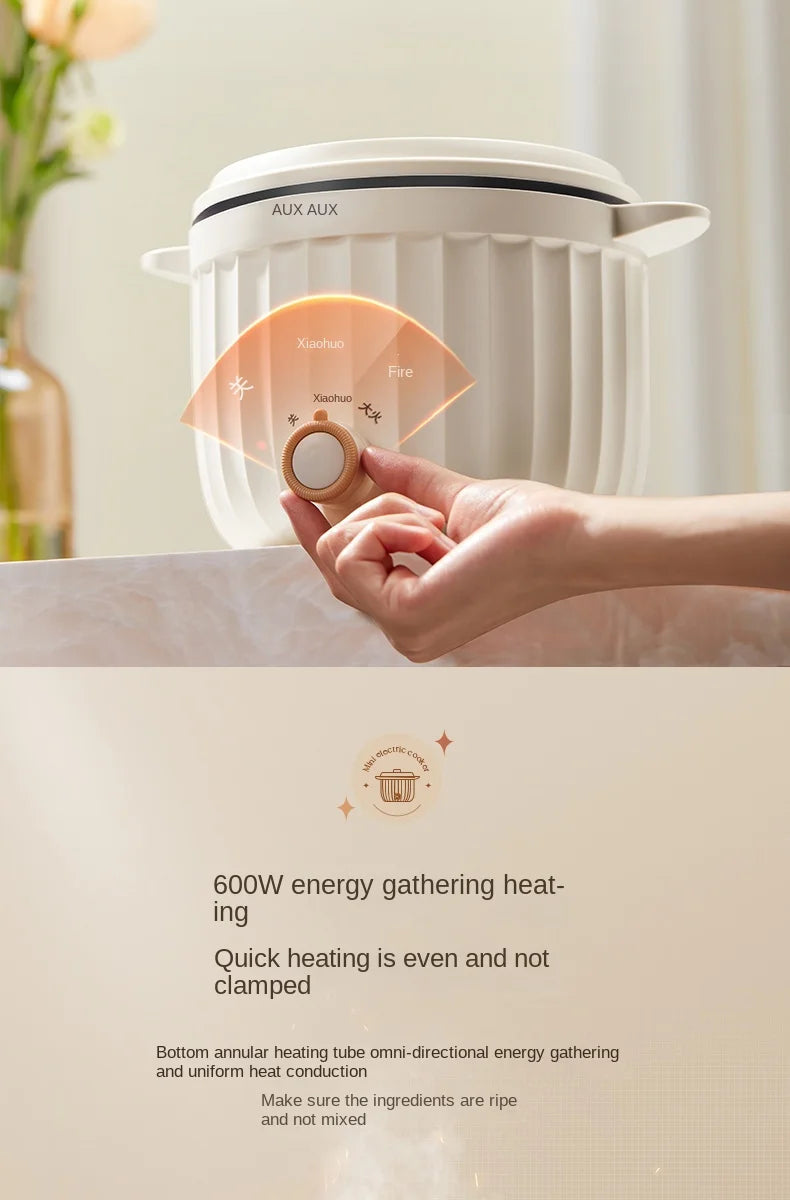 Hand turning the dial on a white electric rice cooker with lid closed