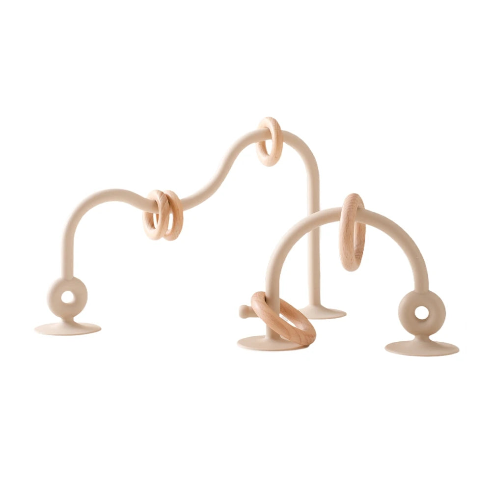 Beige silicone and natural wood baby teething toy rings to soothe gums.