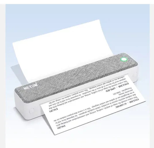 Gray-top thermal label printer with A4 sheets and an output tray holding paper rolls