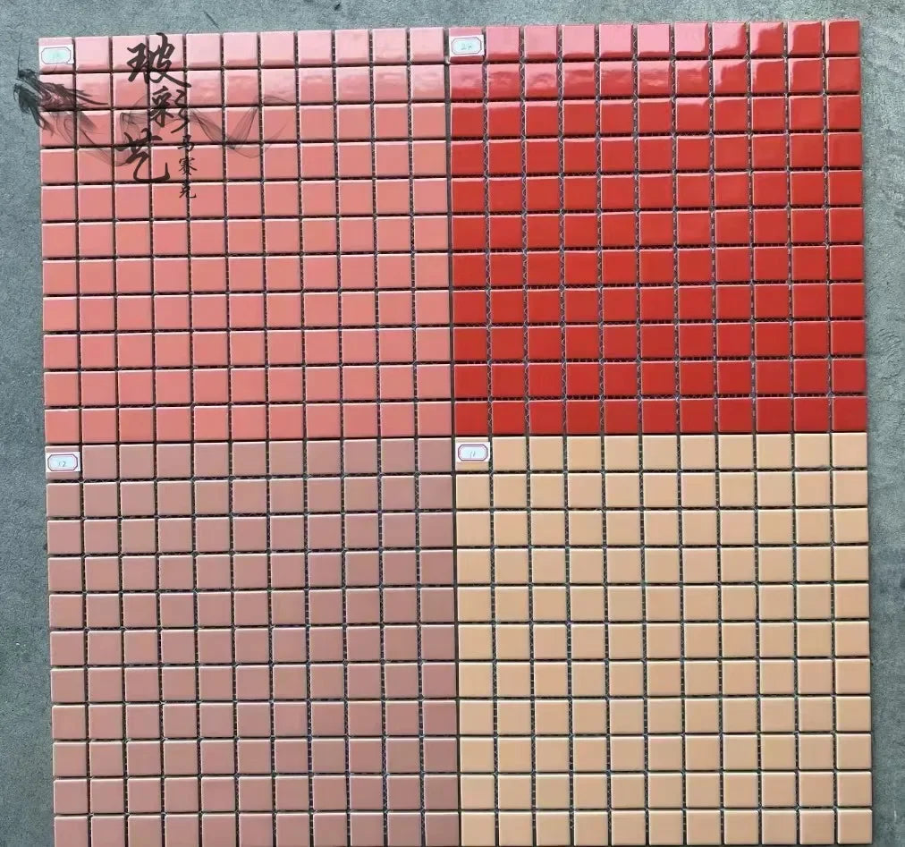 Ceramic mosaic tile sheet with pink, red, and cream small square tiles