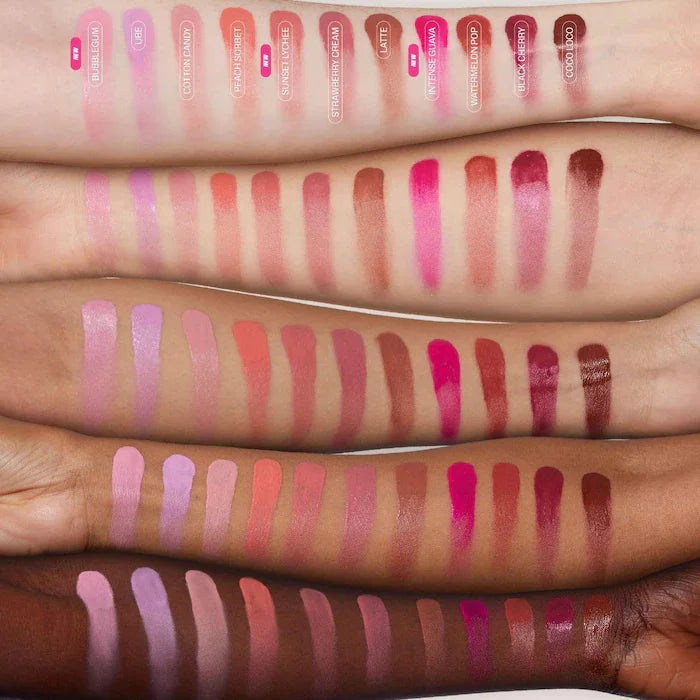 Arm swatches of hydrating lip and cheek blush sticks in various shades ranging from soft pink to deep berry tones.
