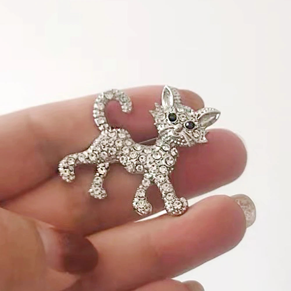 Sparkling silver-tone crystal cat brooch pin, perfect fashion accessory gift for cat lovers to decorate bags and coats.
