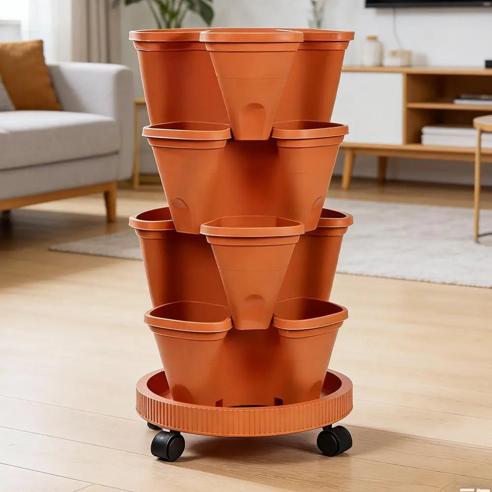 Orange plastic vertical planter tower on wheels with empty stacked pots indoors