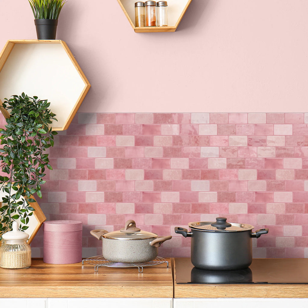 Pink ceramic tile sticker strip backsplash with brick-style rectangular tile pattern