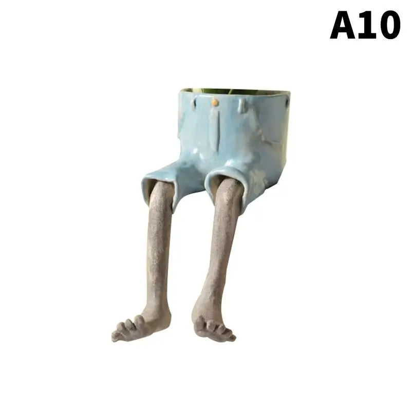 Light blue leggy resin planter with open top and gray bare feet