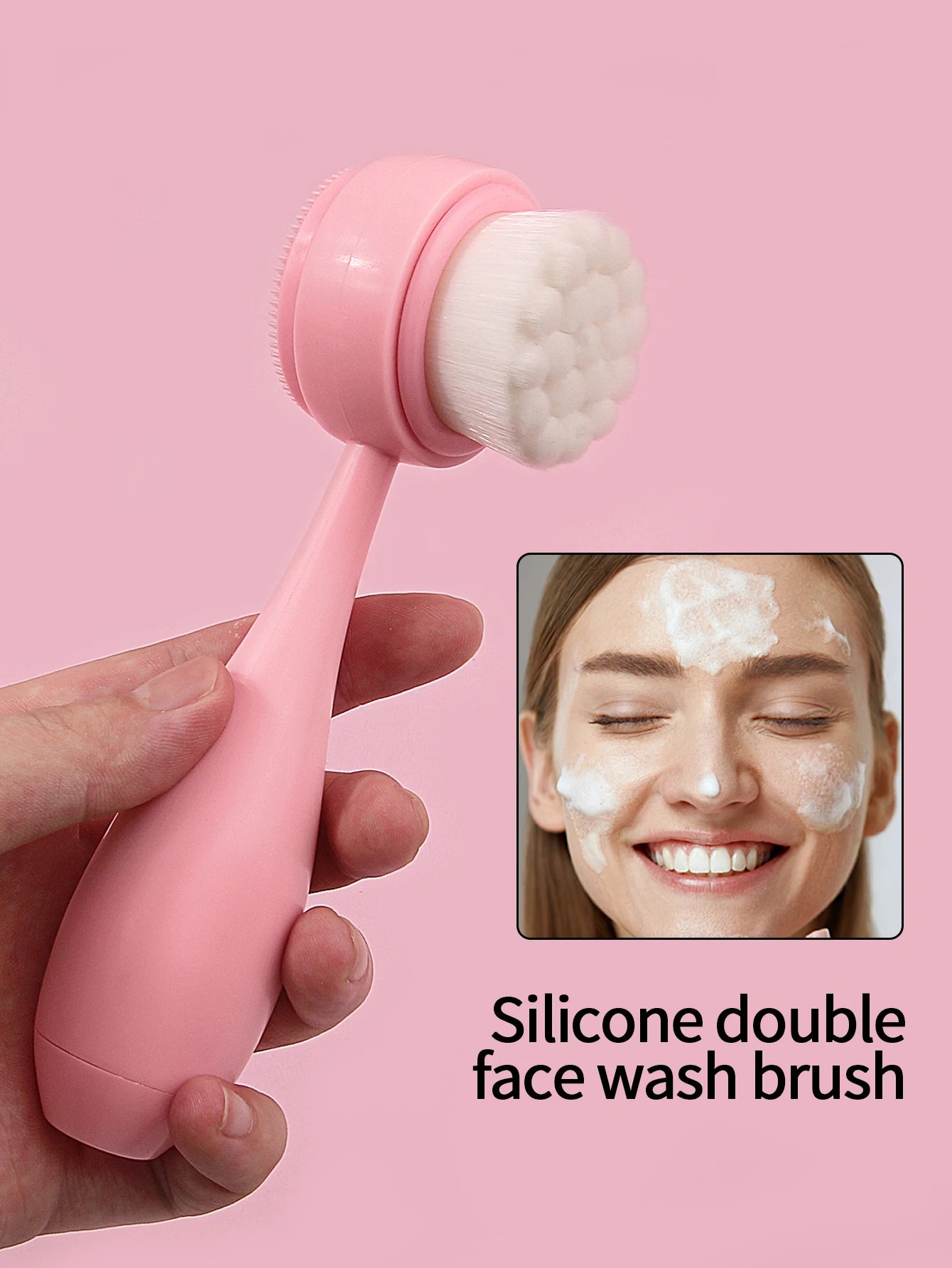 Pink handheld manual facial cleansing brush with dual-sided silicone and soft bristles for face washing and makeup.
