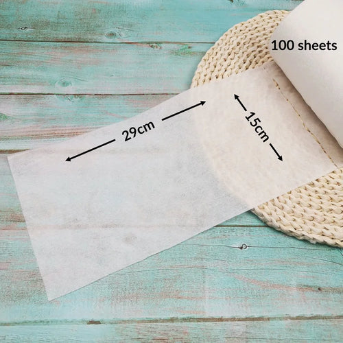 Disposable baby care diaper liners, 100 sheets per roll, measuring 15cm x 29cm, soft and gentle for sensitive skin.