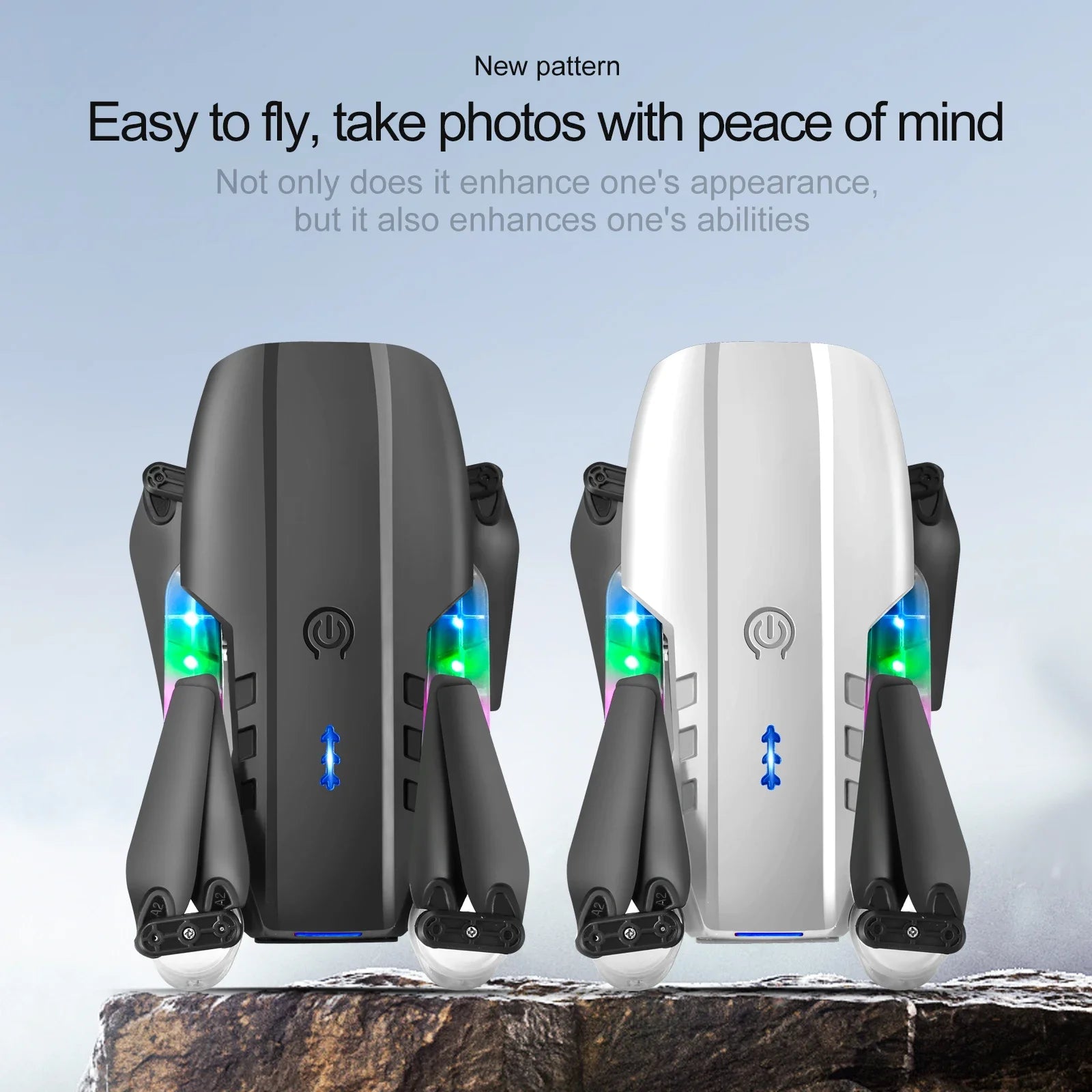 Two compact, foldable camera drones in black and white with glowing LED accents, resting on a rocky surface.