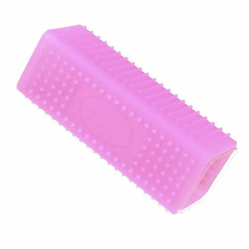 Pink silicone pet hair removal brush for easy dog and cat fur cleaning from furniture and fabrics.