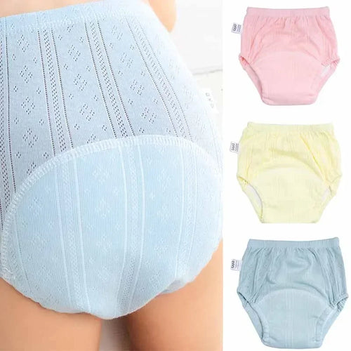 Baby care: set of 3 soft cotton absorbent training pants/diapers in pastel pink, yellow, and blue.