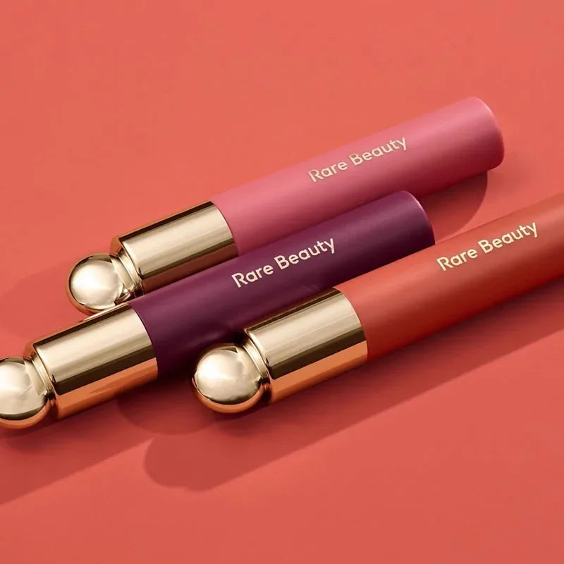 Rare Beauty matte lipsticks with smooth, rich colors and gold accents, offering a comfortable, natural moisture finish.