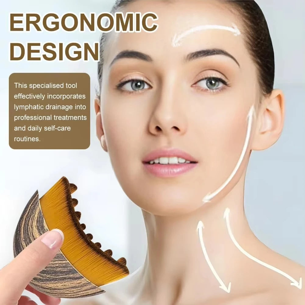 A hand holds a curved, wood-patterned lymphatic face brush with soft, dense bristles against a woman's face.