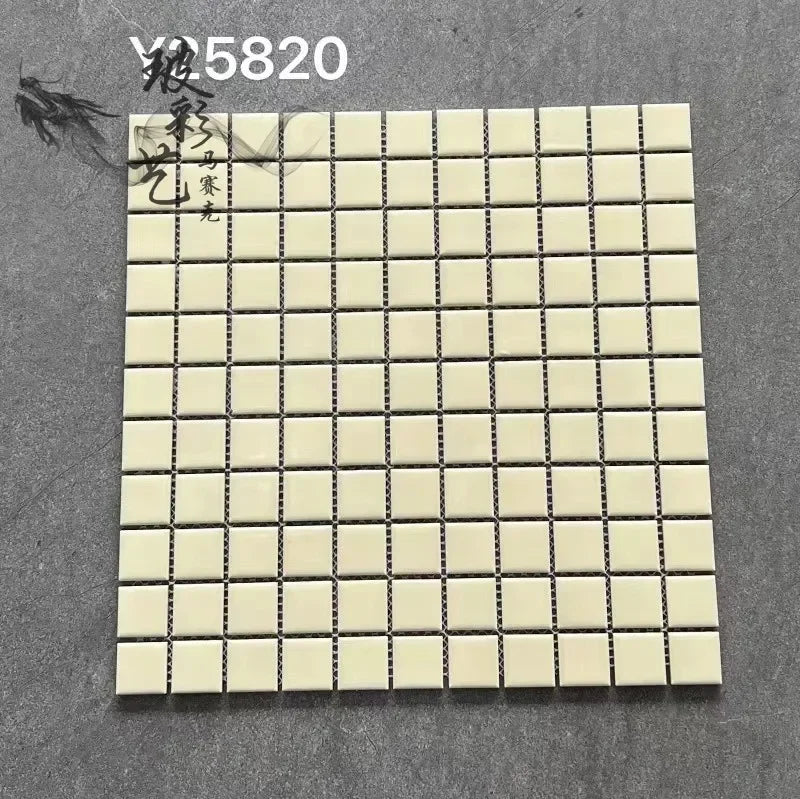 Cream ceramic mosaic tile sheet with glossy square grid and dark grout lines