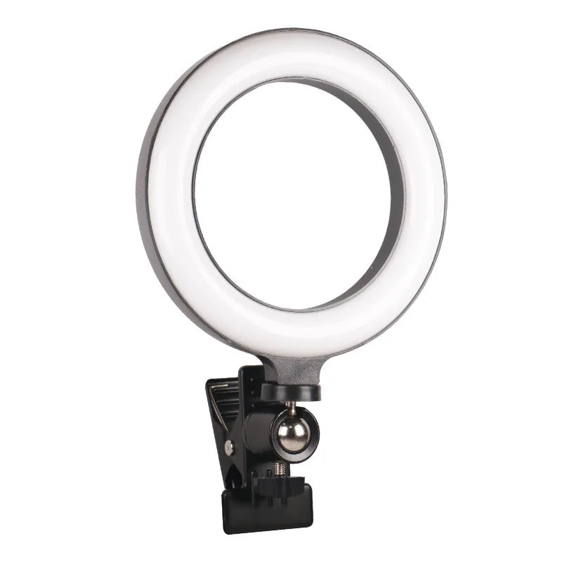 Small circular LED ring light with a black plastic housing and a swivel clip attachment for mounting to devices.