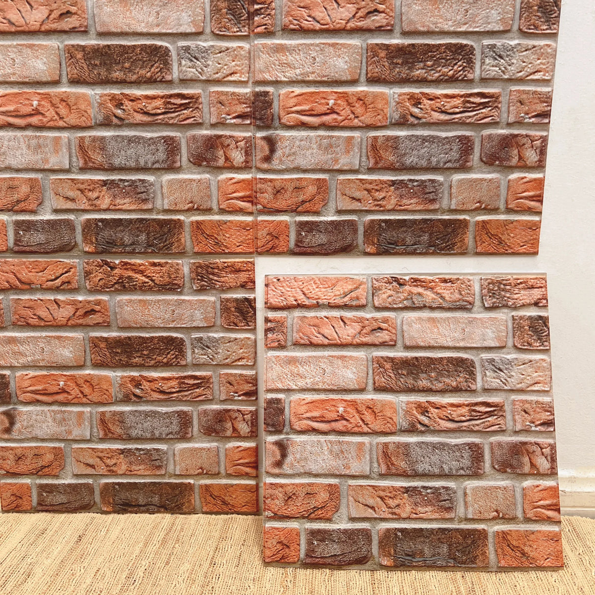 Peel-and-stick brick tile backsplash, orange and white stacked-stone pattern