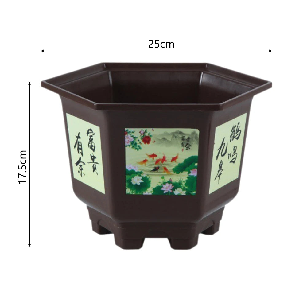 Large dark gray resin flower pot with illustrated panels; measures about 25 cm wide.