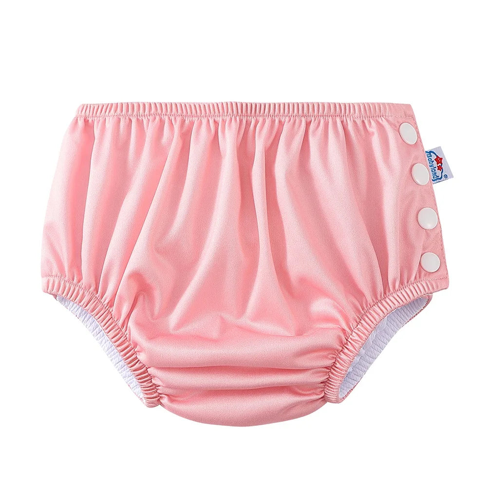 Babyland reusable pink cloth diaper with side snap buttons for baby care.