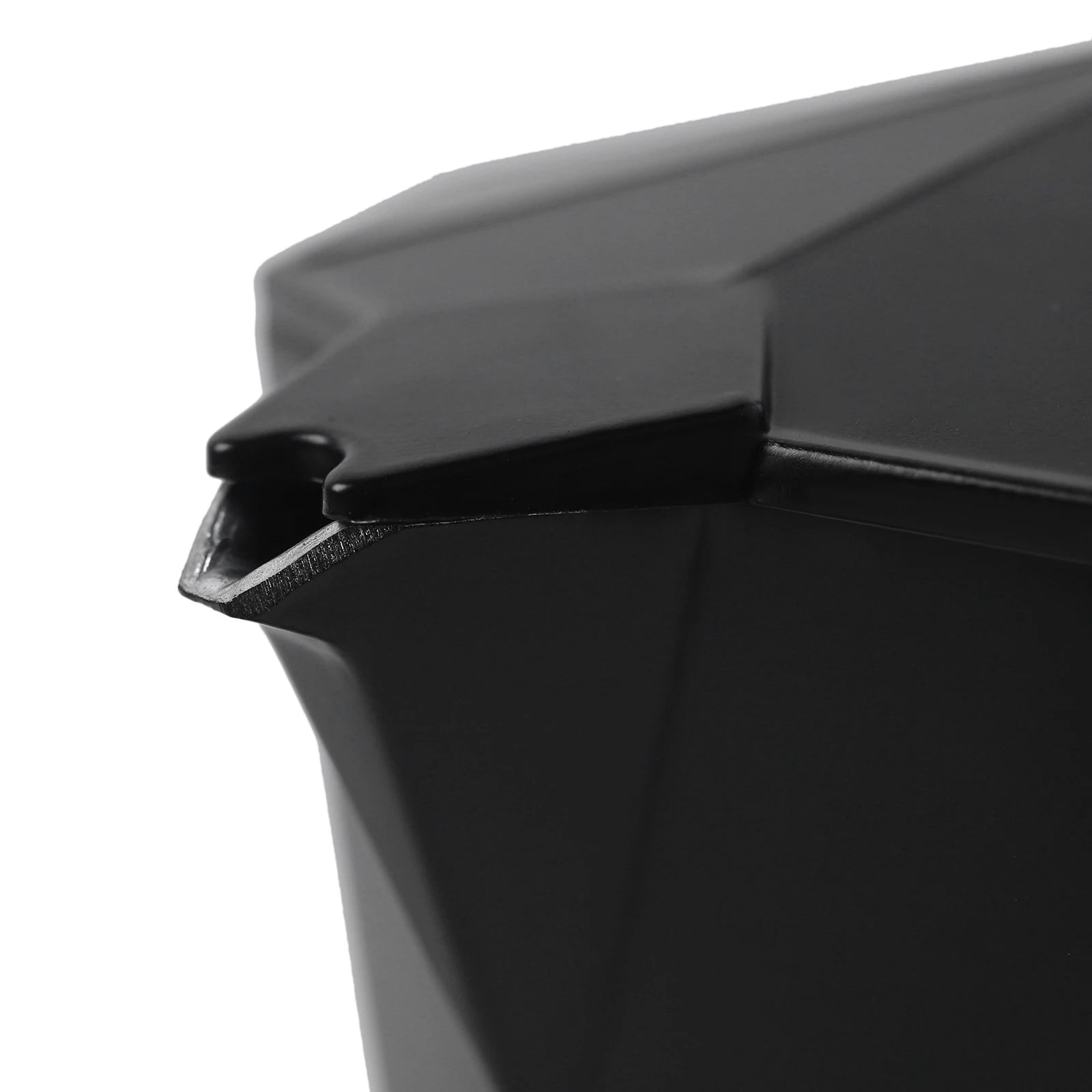 Close-up of a modern matte black geometric moka pot coffee maker spout and lid design.