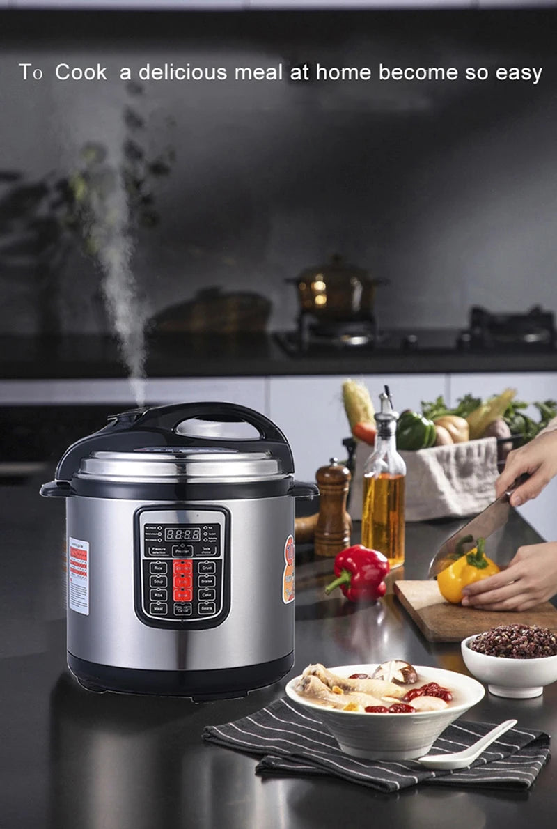 Silver electric pressure cooker on countertop with steam vent and side handle
