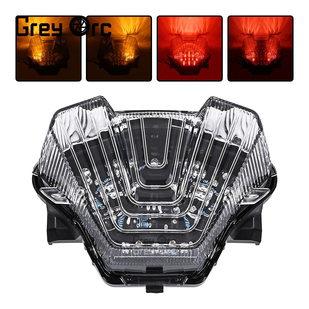 Motorcycle LED rear tail light with clear lens and chrome reflector pattern