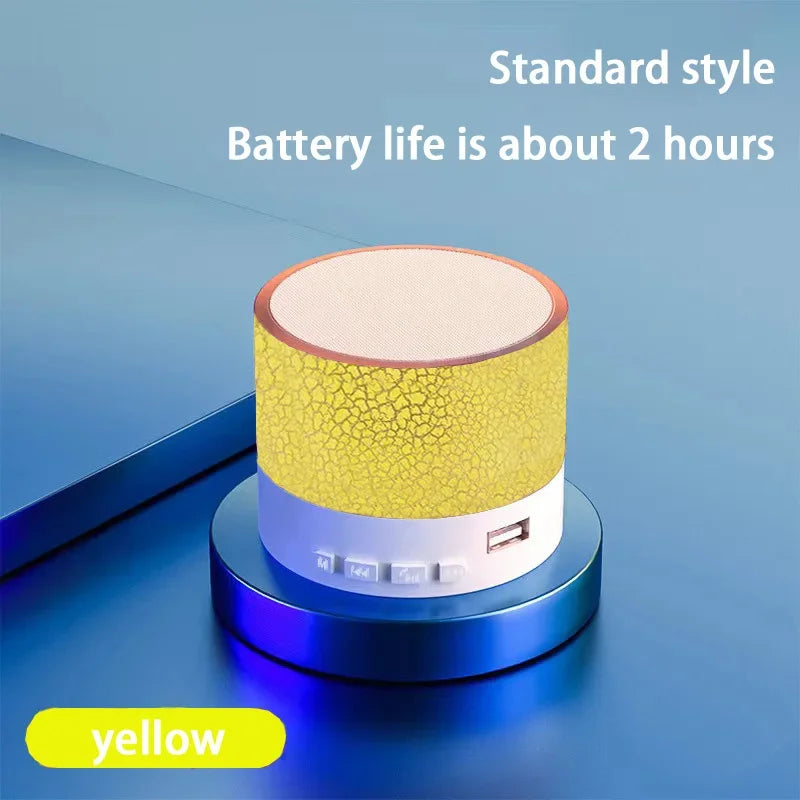 Portable Bluetooth speaker with yellow textured body and beige top panel