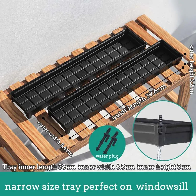 Black plastic drainage tray with grid surface and water plug for plant pots on a stand
