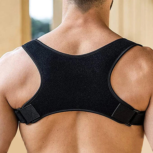 Black posture corrector support brace for sleep apnea relief and improved spinal alignment worn on back.